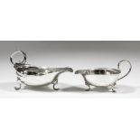 A George III silver oval sauce boat with moulded double C-scroll handle, on scroll feet, 2.75ins