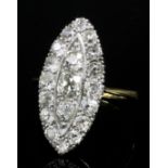 A late Victorian 18ct gold and platinum mounted all diamond set marquise pattern ring, the face