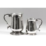 A George III silver baluster-shaped mug with moulded rim and footrim and with leaf capped double