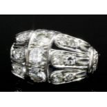 A modern 14ct white gold all diamond set triple band pattern ring, the face set with fifteen