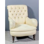 A Victorian scroll back easy chair upholstered in cream cloth, the back buttoned, on turned front