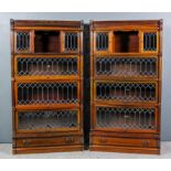 A pair of 1920s Globe Wernicke panelled mahogany four-tier sectional bookcases, the upper parts with