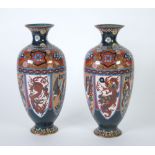 PAIR OF JAPANESE LATE MEIJI PERIOD CLOISONNE VASES, of footed oviform with waisted necks,