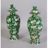 PAIR OF MODERN ORIENTAL PORCELAIN VASES AND COVERS, of oviform with shi-shi pattern finials to the