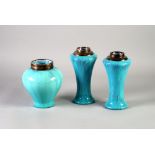 A GARNITURE OF THREE EARLY TWENTIETH CENTURY RUSKIN TYPE STREAKED TURQUOISE GLAZED SILVER MOUNTED