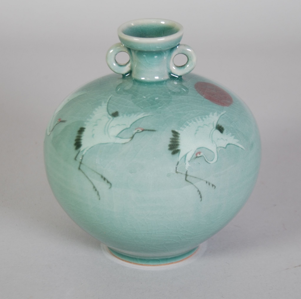TWENTIETH CENTURY ORIENTAL CELADON GLAZED TWO HANDLED POTTERY VASE, of footed orbicular form with