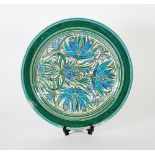 JULIA CARTER PRESTON SGRAFFITO LUSTRE POTTERY WALL PLAQUE, typical form, decorated in tones of blue,