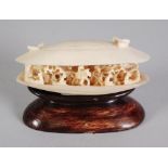 CARVED IVORY CLAM SHELL GROUP, intricately carved with Equestrian and seated figures and trees, 3" x