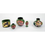 FIVE SMALL PIECES OF WALTER MOORCROFT POTTERY comprising two small vases, two miniature ditto and