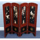 AN EARLY TWENTIETH CENTURY JAPANESE RED AND BLACK LACQUERED DWARF FOUR-FOLD SCREEN,  encrusted