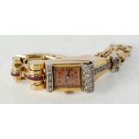 LADY'S DIAMOND AND RUBY SET GOLD CASED BRACELET WATCH, 16 jewel mechanical movement, square copper