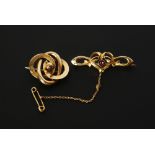 EDWARDIAN GOLD GARNET SET OPENWORK BAR BROOCH, with heart and lily centre, with bezel set garnet,