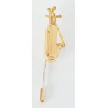 9CT GOLD GOLF CADDY STICK PIN, by JULIE CROSSLAND, London 1989, 3.5cm long excluding base metal pin,