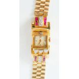 LADY'S DIAMOND AND RUBY SET GOLD CASED BRACELET WATCH, 16 jewel mechanical movement, square arabic