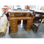 OAK DOUBLE PEDESTAL ROLL TOP DESK, FITTED WITH EIGHT DRAWERS, 4' WIDE