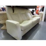 *A STRESSLESS TYPE CREAM HIDE SETTEE WITH THREE INDIVIDUALLY RECLINING SEATS 6' 6" WIDE