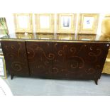 *A CHRISTOPHER GUY COSTLY BLACK LACQUERED AND GILT SCROLL DECORATED LARGE SIDEBOARD WITH POLISHED