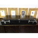 *A WALL MOUNTING DRESSING TABLE, CLAD IN BLACK SIMULATED CROCODILE SKIN WITH WHITE STITCHED EDGES,