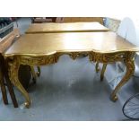 *PAIR OF GILT FINISH ROCOCO STYLE CONSOLE OR WRITING TABLES, OBLONG WITH YOKE FRONTS EACH FITTED