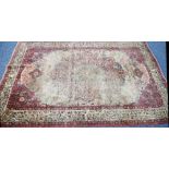 KIRMAN RUG, with large and elaborate petal shaped centre medallion with pendants almost filling