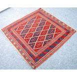 ORIENTAL RUG, with all over diamond or trellis pattern in crimson and midnight blue multiple