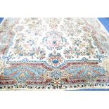 LARGE KIRMAN PERSIAN CARPET, with central floral medallion with pendants and an all over design of
