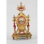 EARLY TWENTIETH CENTURY FRENCH GILT METAL AND PORCELAIN MOULDED MANTEL CLOCK, the 3 1/4" Roman