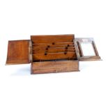 LATE VICTORIAN OAK STATIONERY BOX, the two door sloping front enclosing pigeon holes, removable