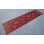 MESHWANI RUNNER with four diamond shaped pole medallions in crimson and midnight blue and with broad