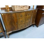 A FIGURED MAHOGANY BOW FRONTED SIDEBOARD, ON CABRIOLE LEGS AND CLAW AND BALL FEET