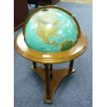 A modern mahogany stained beech wood framed FLOOR STANDING GLOBE with internal electric light