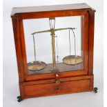 PAIR SMALL EARLY 20th CENTURY BRASS LABORATORY BEAM SCALES of traditional form, in glazed mahogany