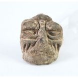 ANTIQUE CARVED STONE PROBABLY SOUTH AMERICAN SMALL GROTESQUE HEAD, the base with thumb size hollowed