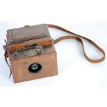 HOUGHTON BUTCHER, 'ENSIGN ROLL FILM REFLEX TROPICAL MODEL' CAMERA, circa 1925, oak and metal mounted