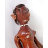 NORTH AMERICAN INDIAN STITCHED LEATHER FEMALE DOLL, of stitched construction with black wig,