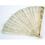 LATE NINETEENTH CENTURY CARVED AND FINELY PIERCED ORIENTAL IVORY BRISE FAN, the outer sticks