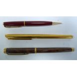 A DUNHILL GOLD PLATED CARTRIDGE FOUNTAIN PEN, with 14k gold nib, numbered 585, A WATERMAN 'IDEAL'