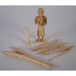 ORIENTAL CARVED IVORY FIGURE, modelled as a man holding a staff and fan, 5 1/2" (14cm) high,