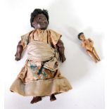 EARLY TWENTIETH CENTURY PROBABLY GERMAN SMALL BISQUE SWIVEL HEADED NEGRO WOMAN DOLL AND BABY, the