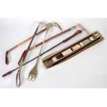 THREE MID TWENTIETH CENTURY RIDING CROPS, stitched and braided leather with staghorn handles,