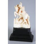 LATE NINETEENTH/EARLY TWENTIETH CENTURY CARVED IVORY GROUP of George and Dragon, modelled in typical