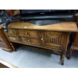 TWENTIETH CENTURY JACOBEAN STYLE OAK DRESSER, WITH TWO CENTRE DRAWERS FLANKED BY TWO CUPBOARD