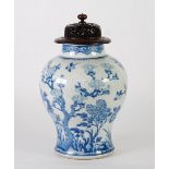NINETEENTH CENTURY CHINESE BLUE AND WHITE PORCELAIN JAR with replacement pierced redwood cover, of