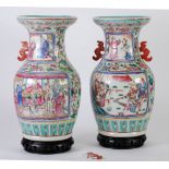 PAIR OF TWENTIETH CENTURY CHINESE CANTON FAMILLE ROSE PORCELAIN VASES, with red flat handles,