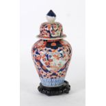 JAPANESE IMARI FLUTED BALUSTER VASE AND COVER, with blue finial, 12" (30.5cm) high