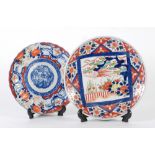 JAPANESE IMARI CIRCULAR PLAQUE, with central square reserve with crane in a landscape, 9 ¾" (24.7cm)