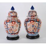 LARGE PAIR OF JAPANESE IMARI BALUSTER VASES AND COVERS, with blue finials, unmarked bases, 13" (
