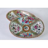 PAIR OF CHINESE CANTON FAMILLE ROSE OVAL DISHES, decorated with four reserves with interior scenes
