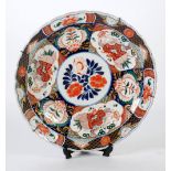 LARGE JAPANESE IMARI CIRCULAR PLAQUE WITH SCALLOPED EDGE, the centre decorated with flowers and with