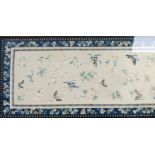 ORIENTAL NEEDLEWORK ON SILK PANEL, hand worked in colours with butterflies and floral sprigs, within